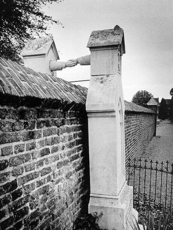 “The graves of Colonel J.C.P.H and Catholic noblewoman J.W.C Van Gorkum.  They were married in 1842.  In 1888, Van Gorkum died, she wanted to be buried next to her husband. Pillarisation (a form of religious and political segregation in Holland) was still in effect at the time, and according to the law, this was impossible.  His wife was buried on the other side of the wall, which was the closest she could get to her husband.” 